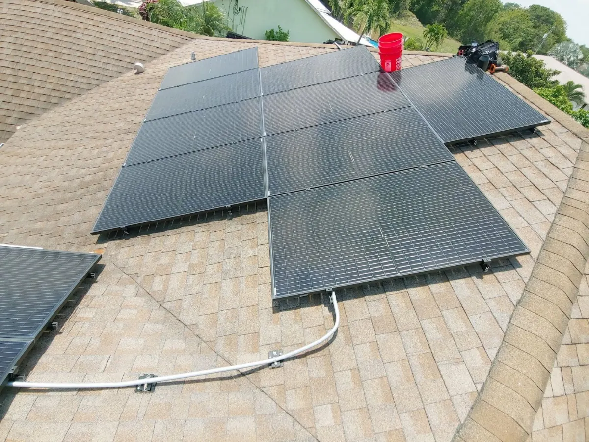 Solar panels set on new mounts on a shingle roof